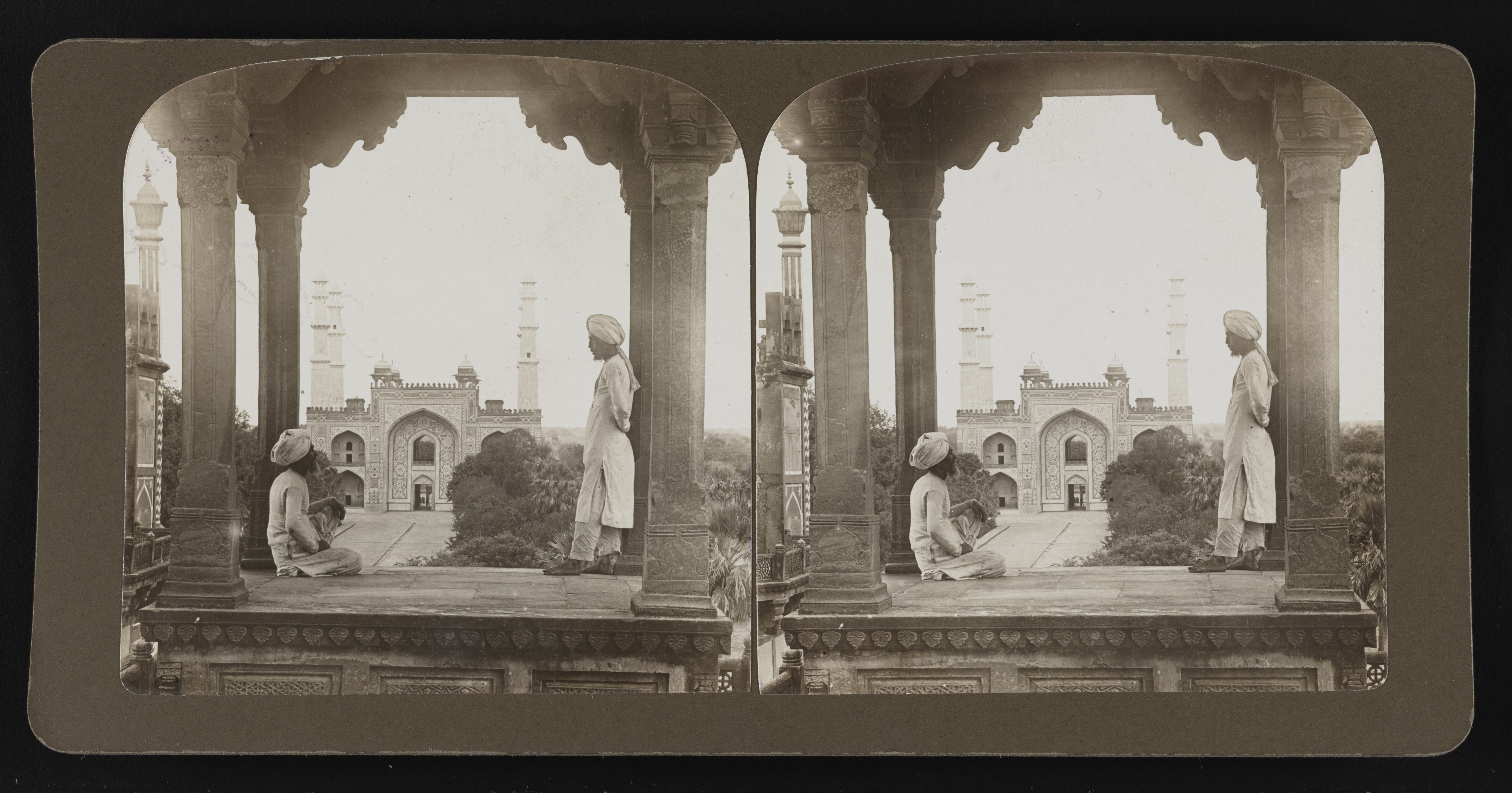 Two men looking at Akbar's tomb